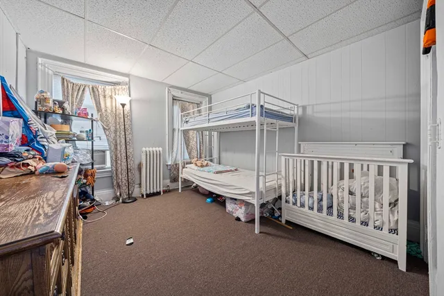 a room with lots of furniture and a window