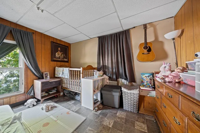 a bedroom with furniture and a window