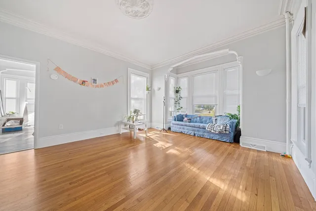 a view of a livingroom with wooden floor