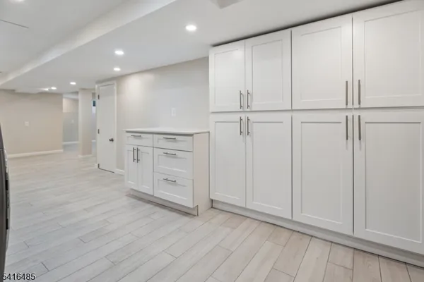 an empty room with wooden floor