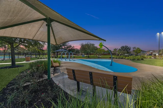 a view of a backyard with a patio and table
