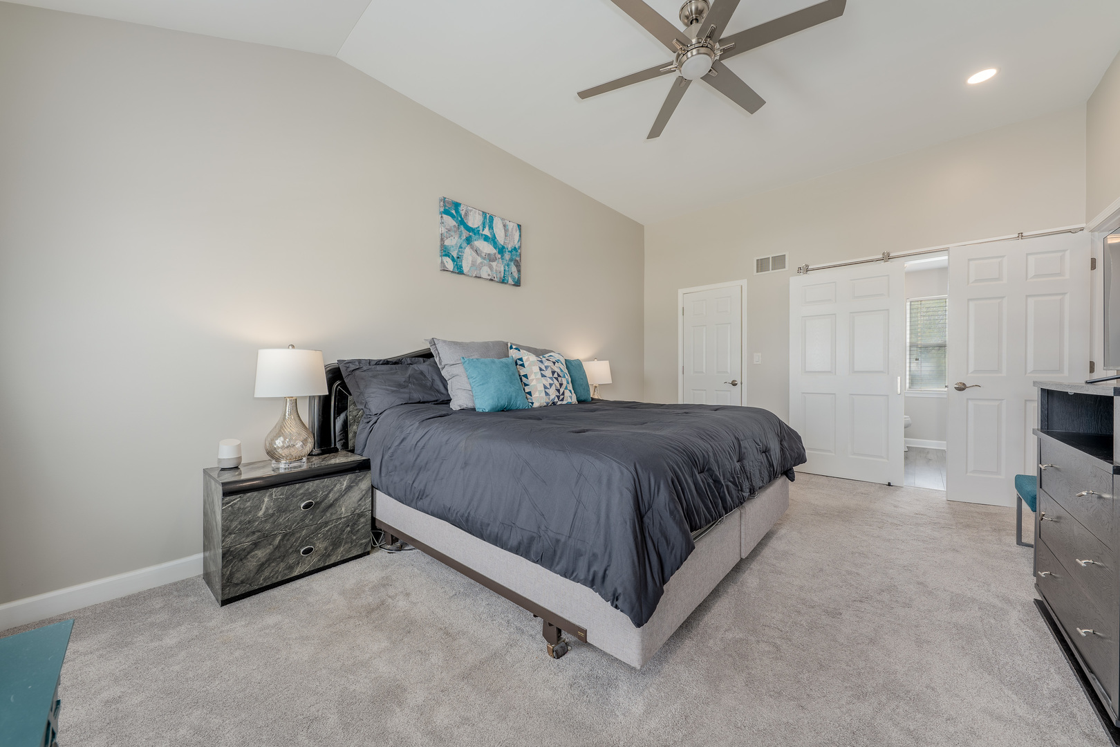 2040 Garfield Avenue Aurora, IL 60506 - Photo 14 of 32 a spacious bedroom with a bed and a chandelier