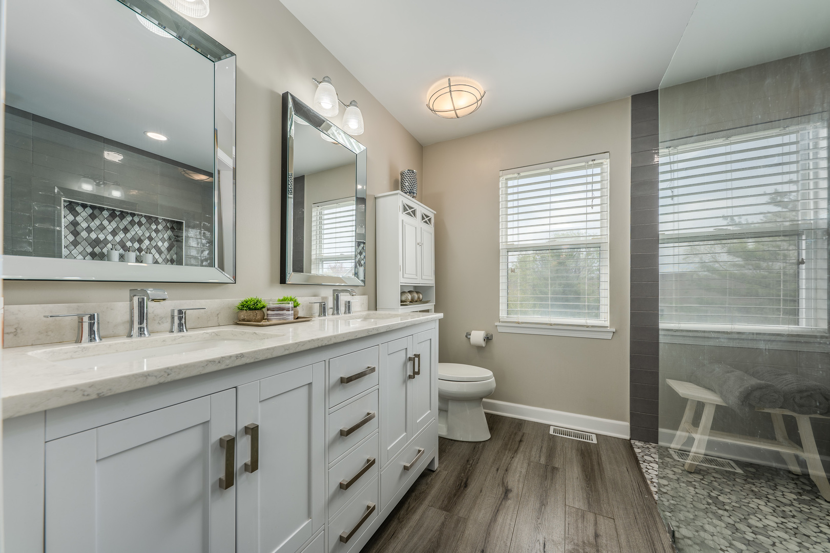 2040 Garfield Avenue Aurora, IL 60506 - Photo 15 of 32 a bathroom with a granite countertop sink toilet a large mirror a vanity and window