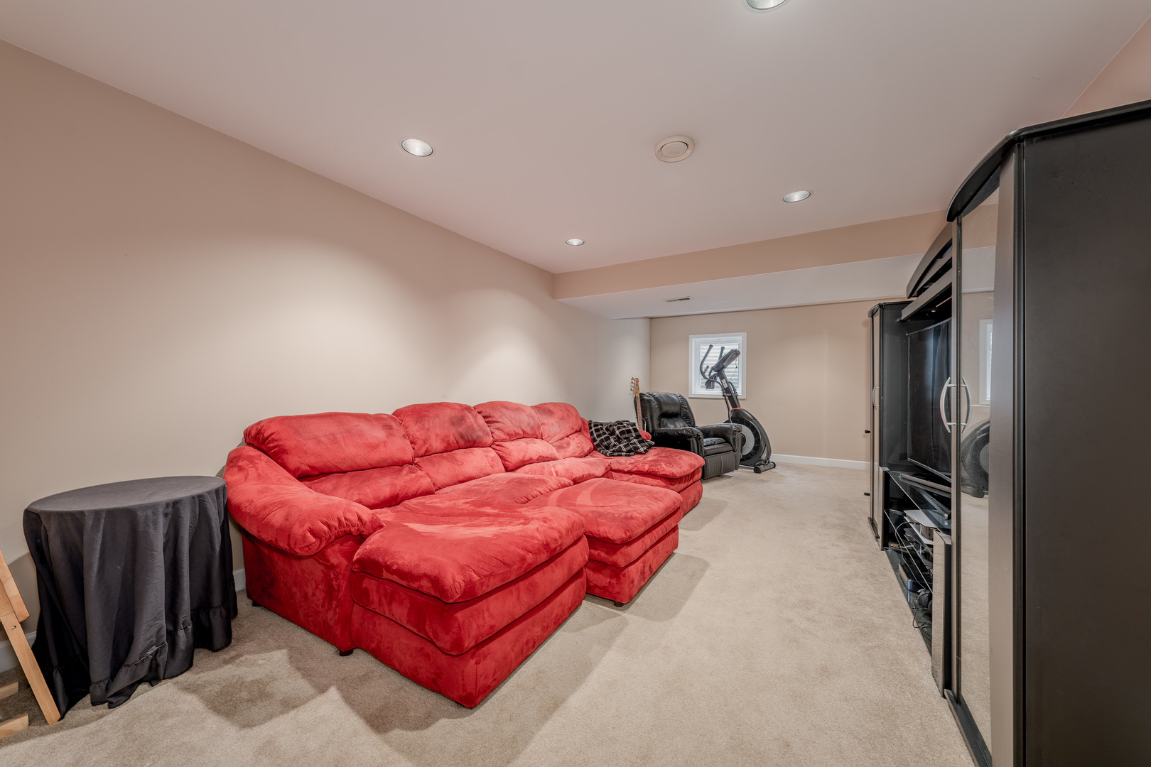 2040 Garfield Avenue Aurora, IL 60506 - Photo 24 of 32 a living room with furniture a flat screen tv and a lamp