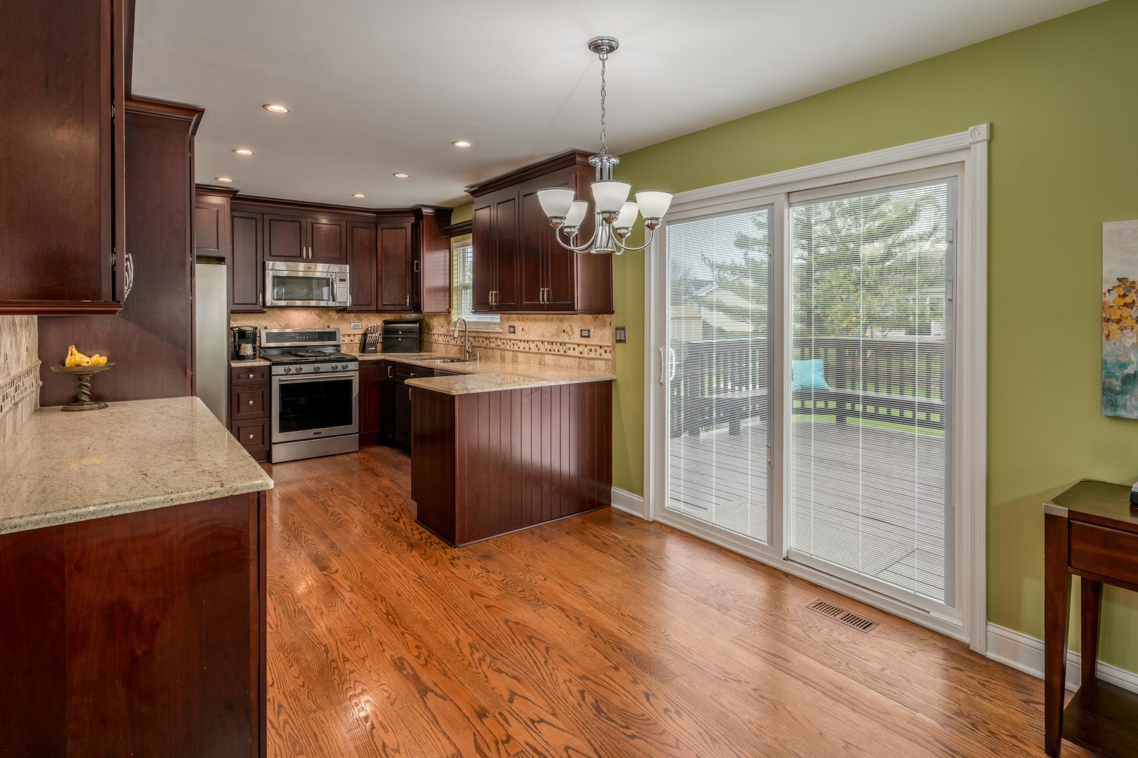 2040 Garfield Avenue Aurora, IL 60506 - Photo 9 of 32 a kitchen with stainless steel appliances granite countertop a stove top oven a sink and a refrigerator