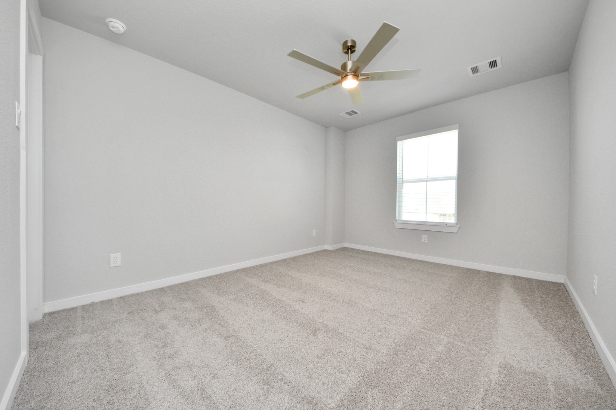 3002 Bury Park Dr Spring Spring, TX 77373 - Photo 35 of 45 Generously sized secondary bedrooms featuring spacious closets, soft and inviting carpeting underfoot, large windows allowing plenty of natural light, and the added touch of privacy blinds for your personal retreat.
