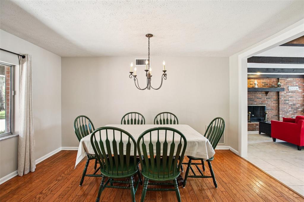19254 Blount Road Lutz, FL 33558 - Photo 17 of 35 a view of a dining room with furniture window and wooden floor