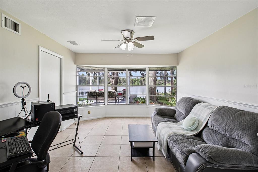 19254 Blount Road Lutz, FL 33558 - Photo 18 of 35 a living room with furniture and a large window