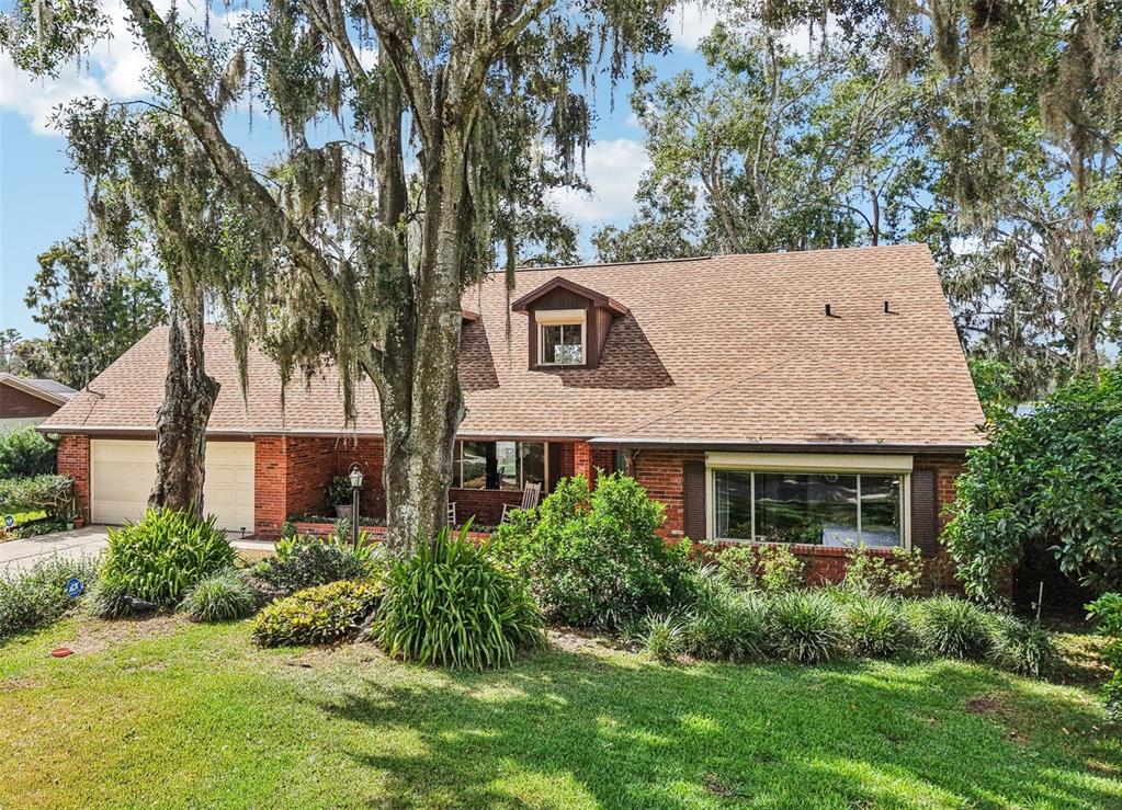 19254 Blount Road Lutz, FL 33558 - Photo 2 of 35 front view of a house with a yard