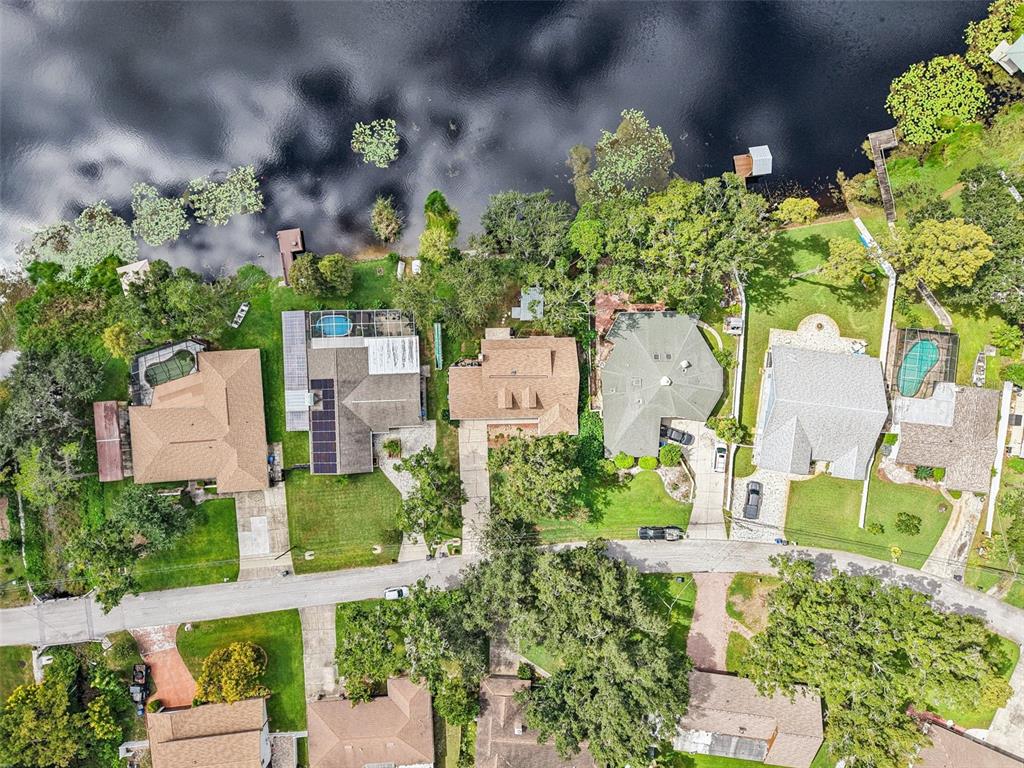 19254 Blount Road Lutz, FL 33558 - Photo 32 of 35 an aerial view of a house with a yard and garden