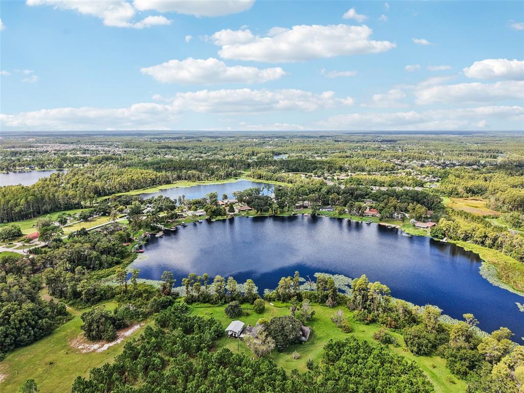 19254 Blount Road Lutz, FL 33558 - Photo 35 of 35 an aerial view of residential building and lake