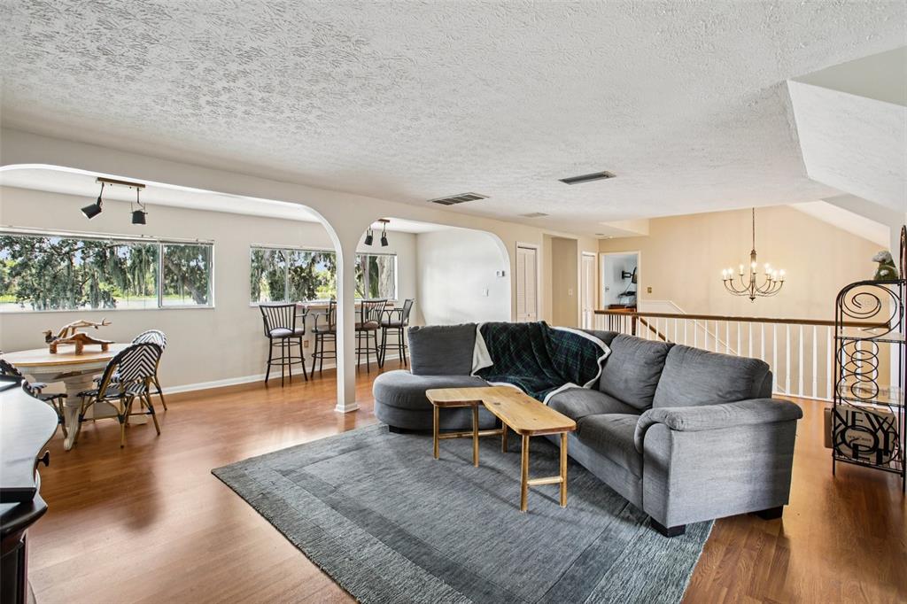19254 Blount Road Lutz, FL 33558 - Photo 9 of 35 a living room with furniture and wooden floor