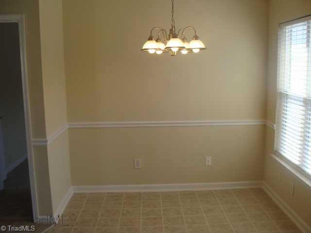 2910 WaterStone Loop High Point, NC 27265 - Photo 4 of 9 Other. Dining room big enough for nice size table with doors that lead out to private back patio. Chair rail moldings to add extra class.