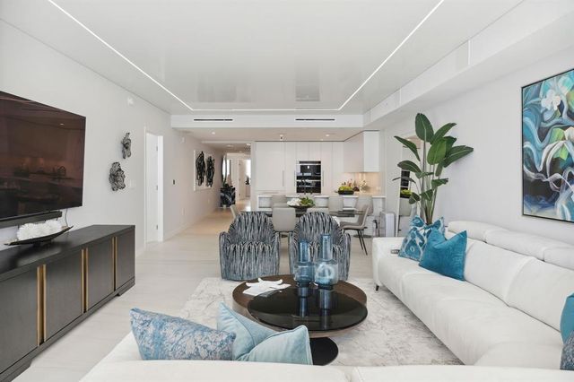 a bedroom with a bed flowerpot and window