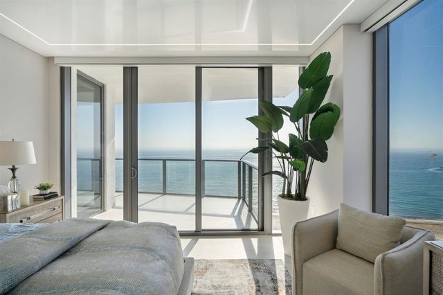 a view of a bedroom with a furniture and closet