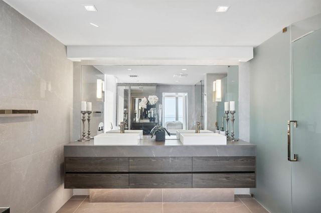 a living room with furniture a rug and a flat screen tv