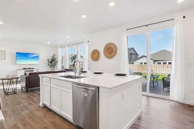 a kitchen with a sink and a stove top oven