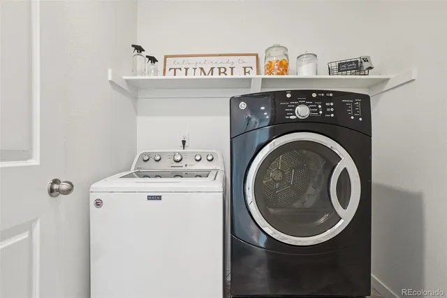 a utility room with dryer and washer