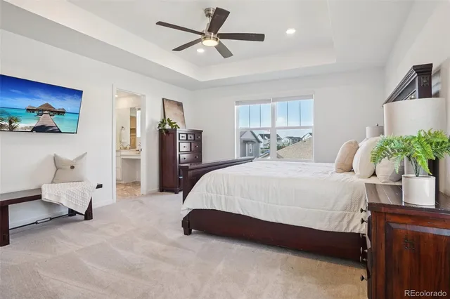 a bedroom with a large bed and a window