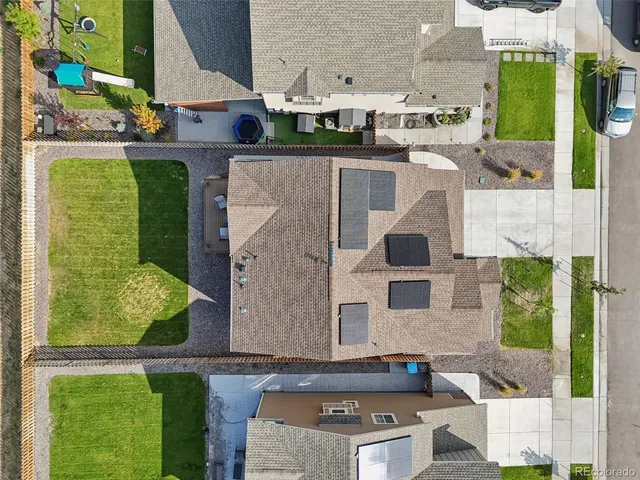 aerial view of a multi story residential apartment building with a yard