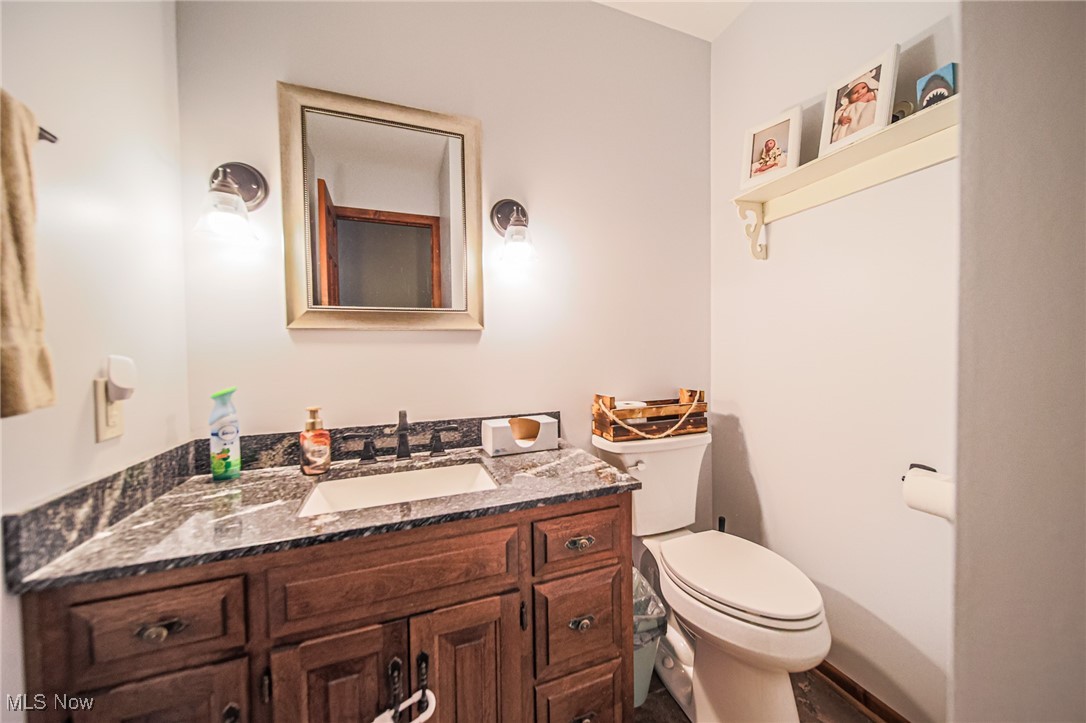 1791 Beal Road Mansfield, OH 44903 - Photo 40 of 50 Half bathroom with vanity and toilet