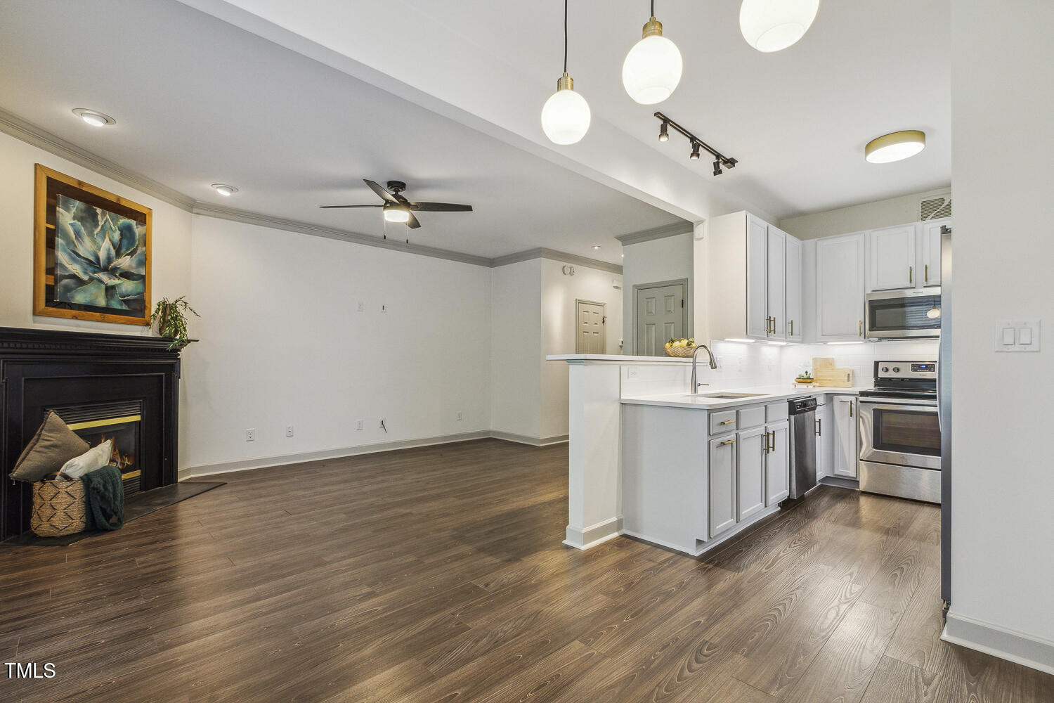 5402 Goldenglow Way Raleigh, NC 27606 - Photo 12 of 44 a view of kitchen with sink and wooden floor