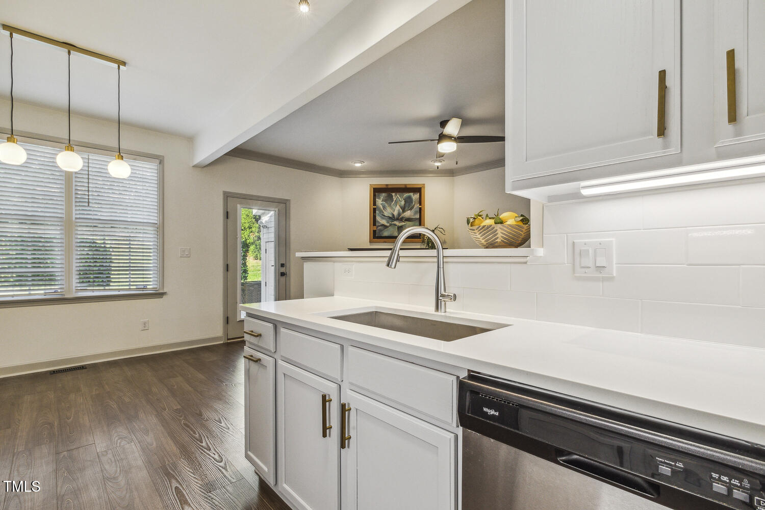 5402 Goldenglow Way Raleigh, NC 27606 - Photo 18 of 44 a kitchen with a sink appliances and cabinets