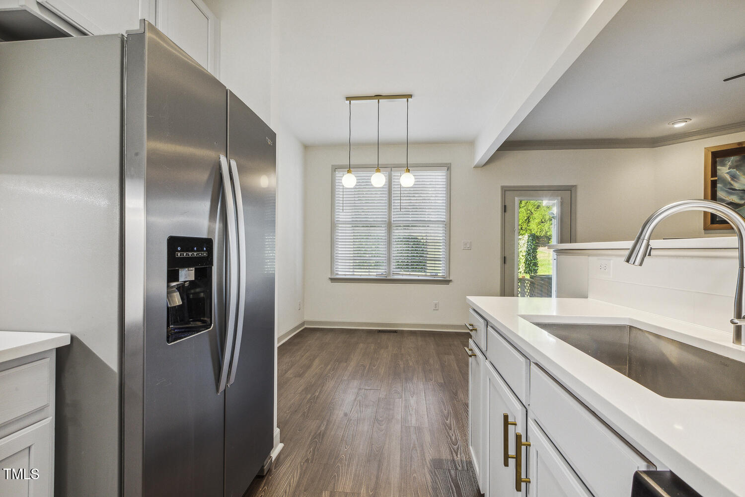 5402 Goldenglow Way Raleigh, NC 27606 - Photo 19 of 44 a kitchen with stainless steel appliances granite countertop a refrigerator and a sink