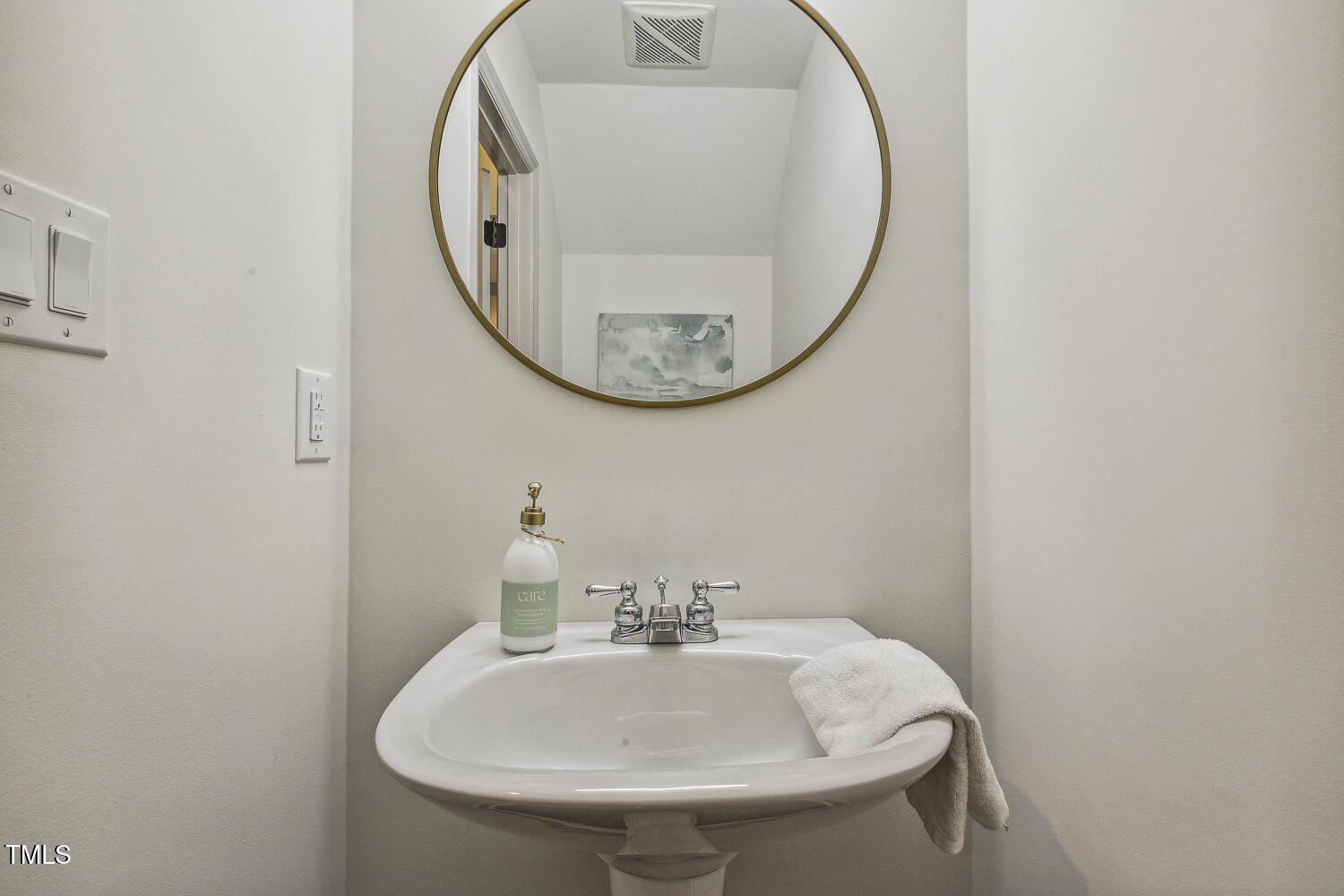 5402 Goldenglow Way Raleigh, NC 27606 - Photo 20 of 44 a bathroom with a sink and a mirror