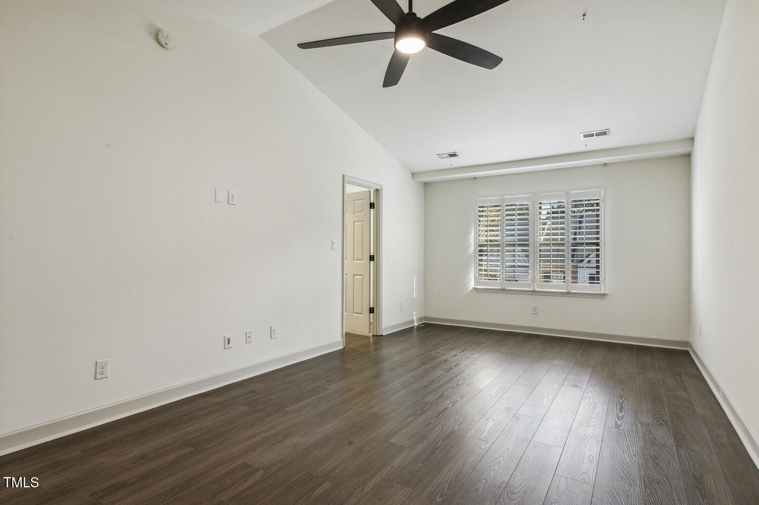 5402 Goldenglow Way Raleigh, NC 27606 - Photo 22 of 44 wooden floor in an empty room with a window
