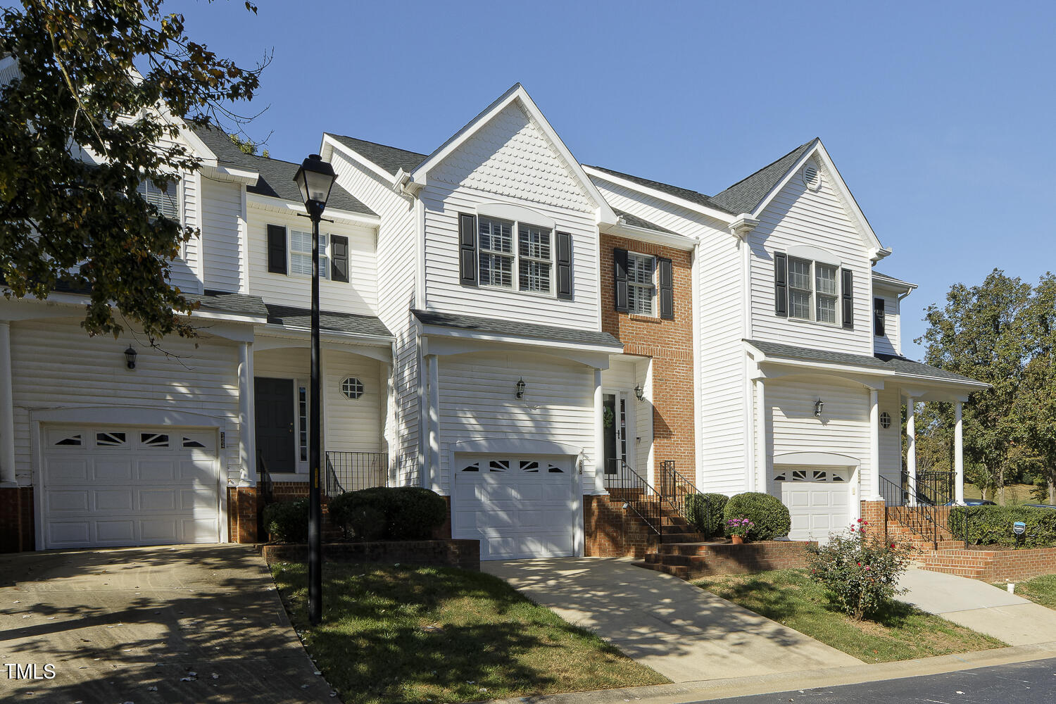 5402 Goldenglow Way Raleigh, NC 27606 - Photo 3 of 44 a front view of a house with a yard
