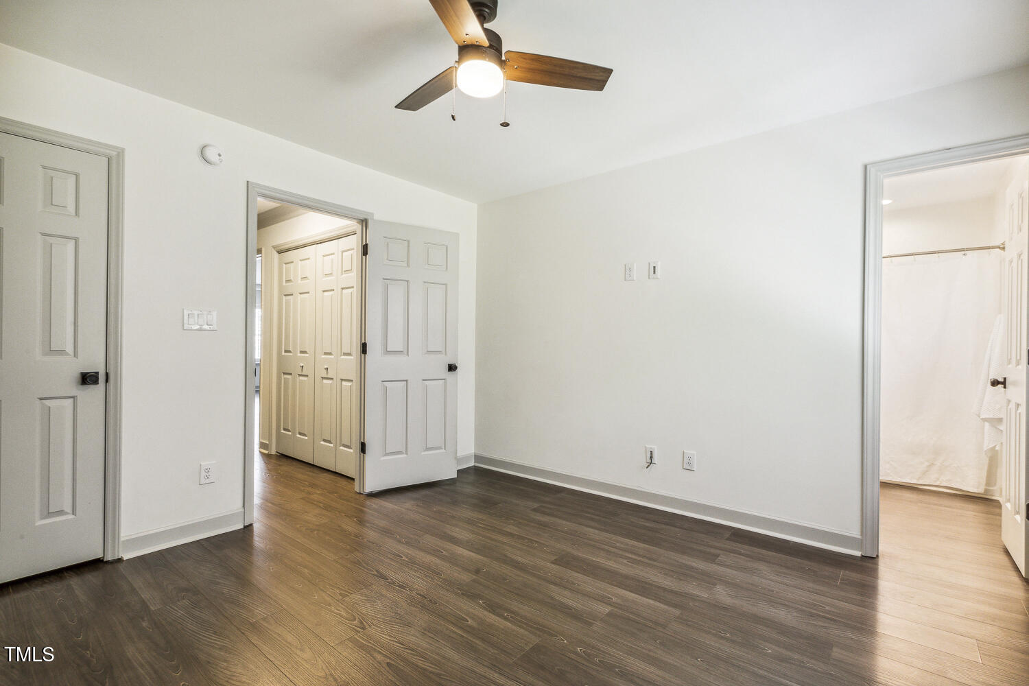 5402 Goldenglow Way Raleigh, NC 27606 - Photo 31 of 44 an empty room with wooden floor and windows