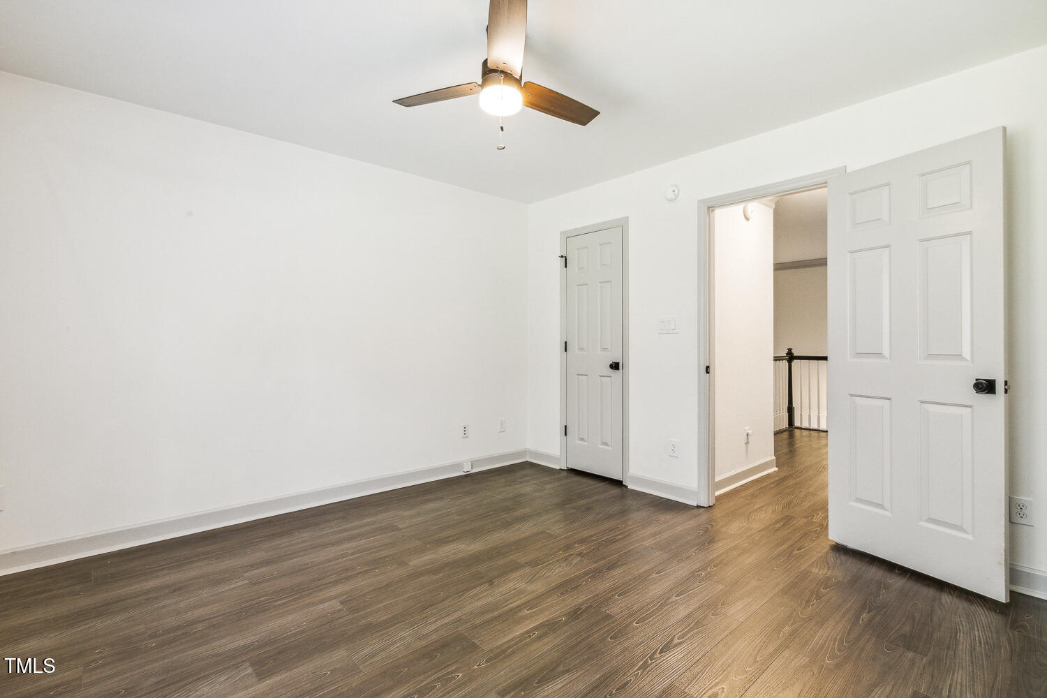 5402 Goldenglow Way Raleigh, NC 27606 - Photo 32 of 44 wooden floor in an empty room with a window