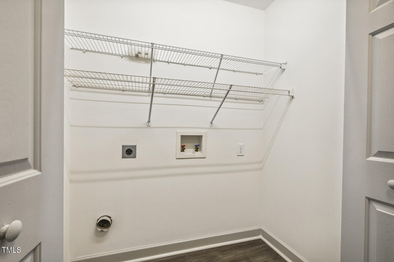 5402 Goldenglow Way Raleigh, NC 27606 - Photo 34 of 44 a view of a room with racks on the wall
