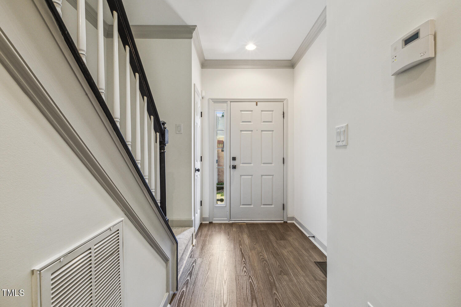 5402 Goldenglow Way Raleigh, NC 27606 - Photo 5 of 44 wooden floor in an empty room with a gallery