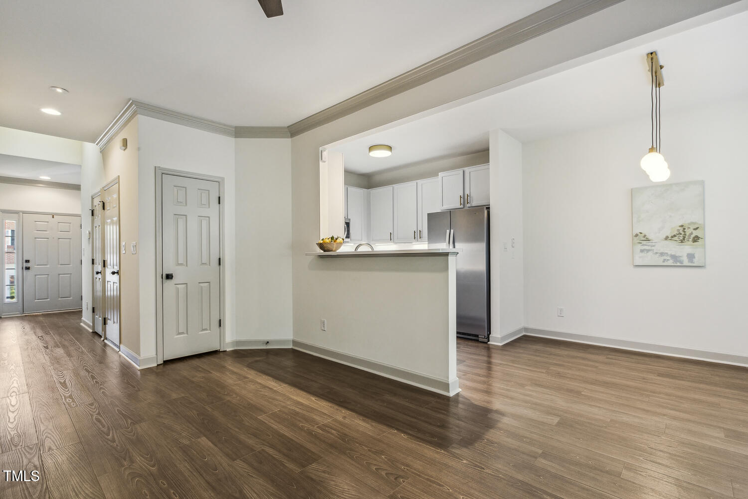 5402 Goldenglow Way Raleigh, NC 27606 - Photo 10 of 44 a view of a kitchen with wooden floor and a window