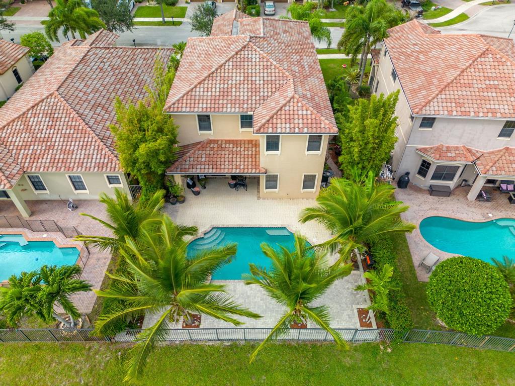 7302 Northwest 111th Way Parkland, FL 33076 - Photo 1 of 36 an aerial view of a house with swimming pool and patio