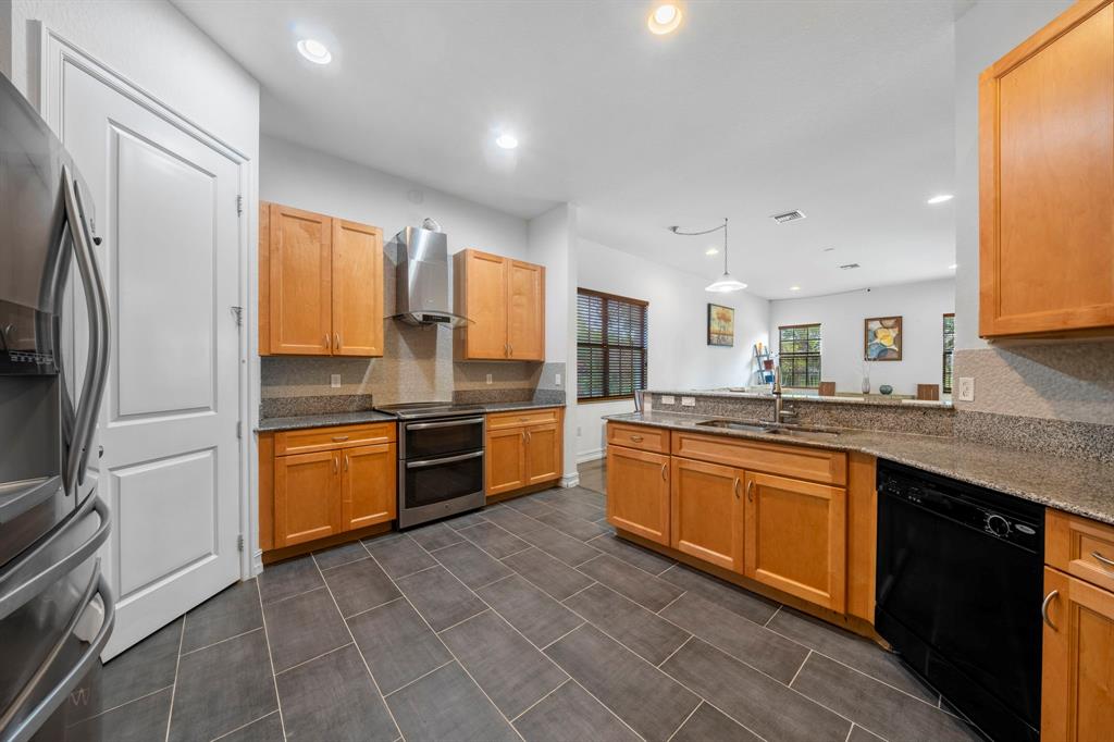 7302 Northwest 111th Way Parkland, FL 33076 - Photo 12 of 36 a large kitchen with stainless steel appliances lots of counter space and a sink