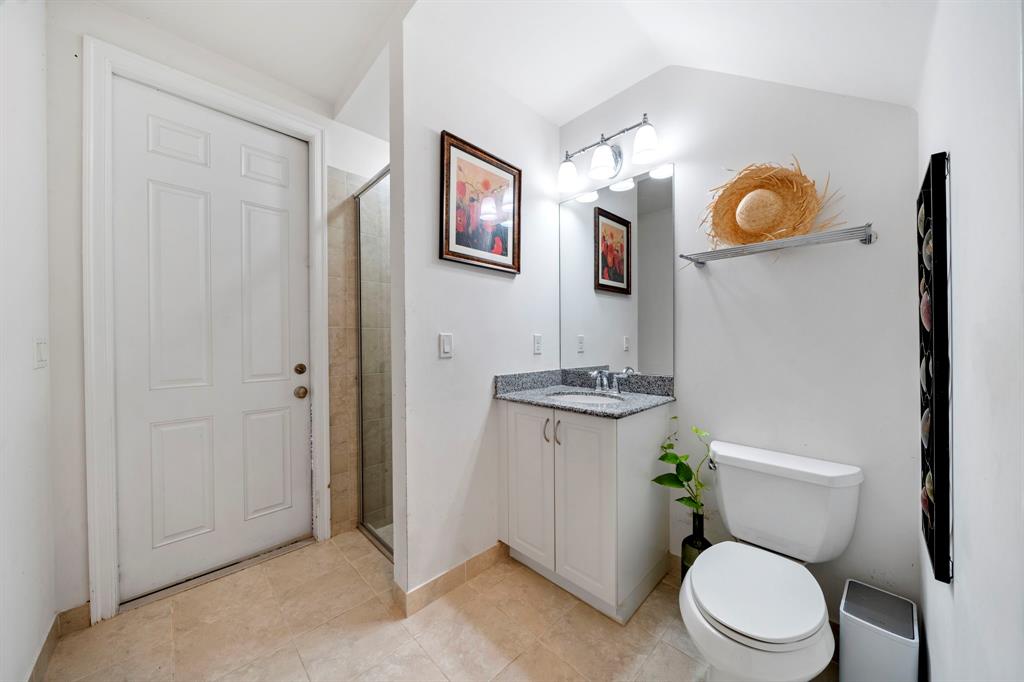 7302 Northwest 111th Way Parkland, FL 33076 - Photo 13 of 36 a white toilet sitting next to a bathroom sink and vanity