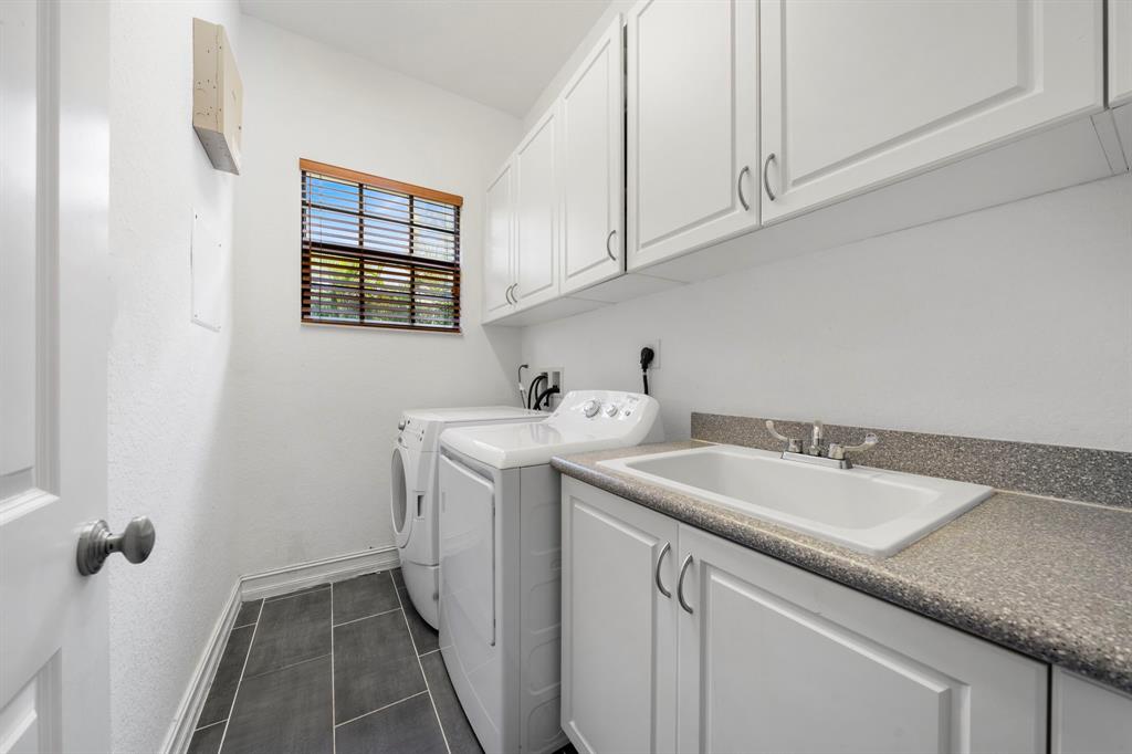 7302 Northwest 111th Way Parkland, FL 33076 - Photo 14 of 36 a utility room with sink dryer and washer