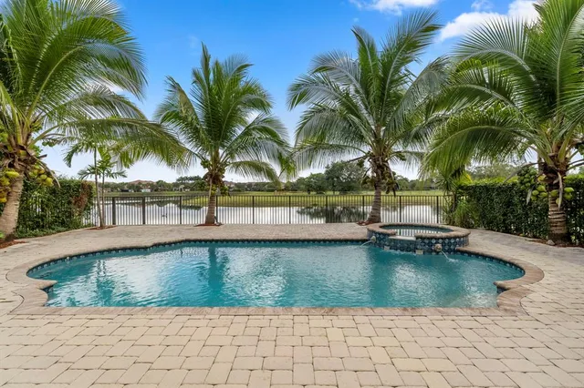 a view of a swimming pool with a table and chairs
