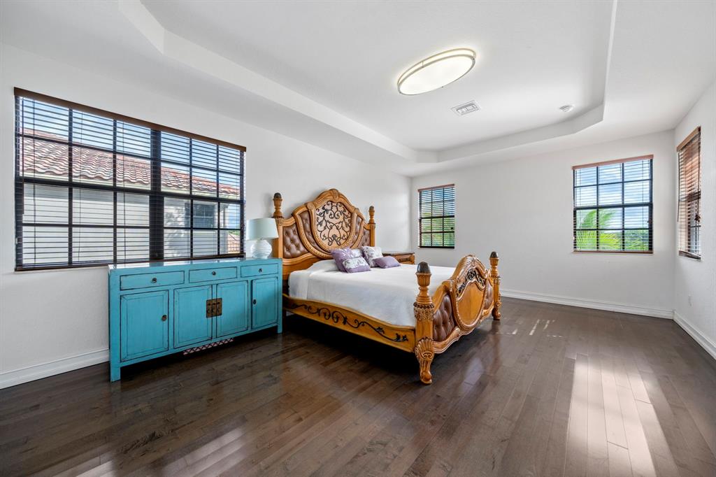 7302 Northwest 111th Way Parkland, FL 33076 - Photo 20 of 36 a bedroom with a bed and a window