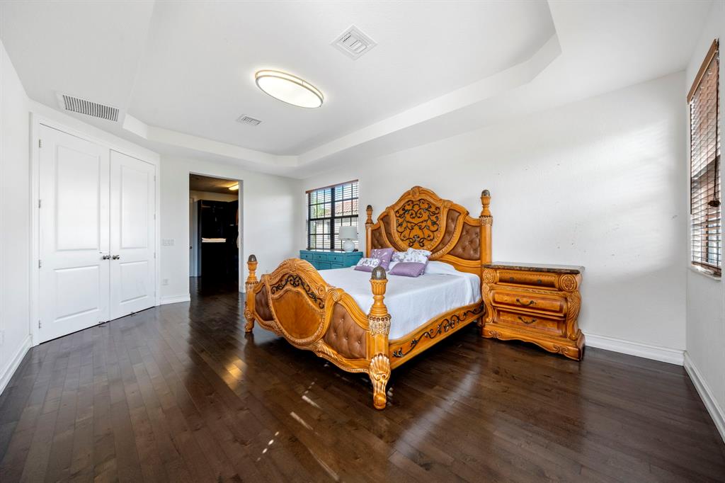 7302 Northwest 111th Way Parkland, FL 33076 - Photo 21 of 36 a bedroom with bed and window