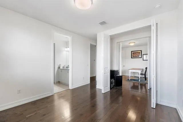 a view of a livingroom with furniture and wooden floor