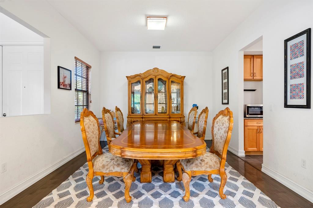 7302 Northwest 111th Way Parkland, FL 33076 - Photo 7 of 36 a view of a dining room with furniture