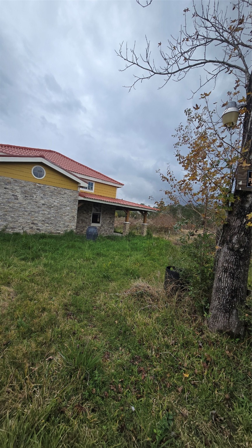 3535 Peveto Road Orange, TX 77632 - Photo 3 of 11 a front view of a house with garden