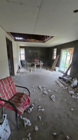 a bedroom with furniture and a window