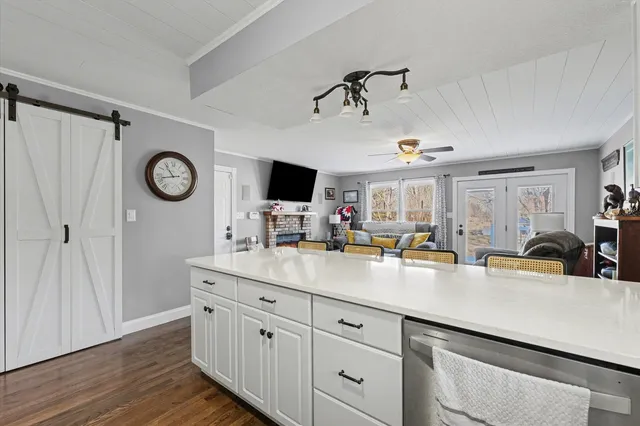 a kitchen with cabinets a sink and appliances