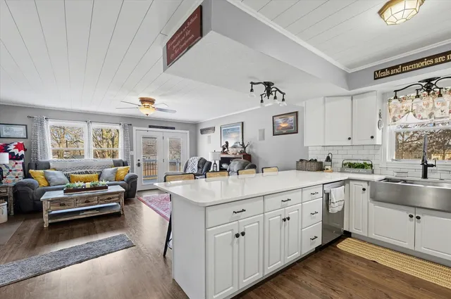 a kitchen with sink and cabinets