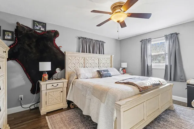 a bedroom with bed and window